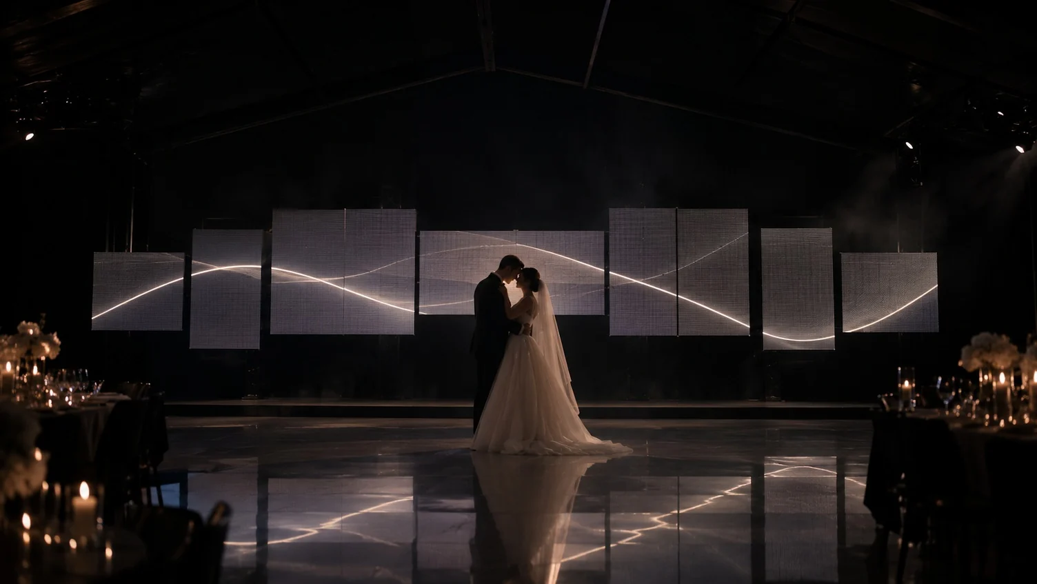 Kinetic LED modules forming a stage behind a couple, SHOW PLUS presentation